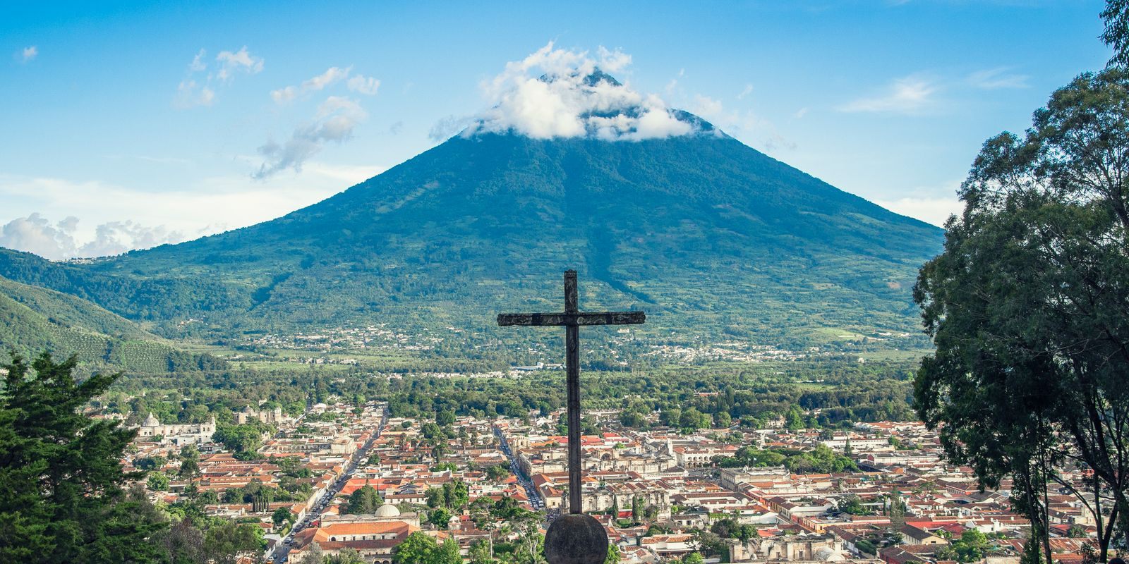 Antigua Guatemala beneath Volcan de Agua, a favorite outing on Central America cruises 2027