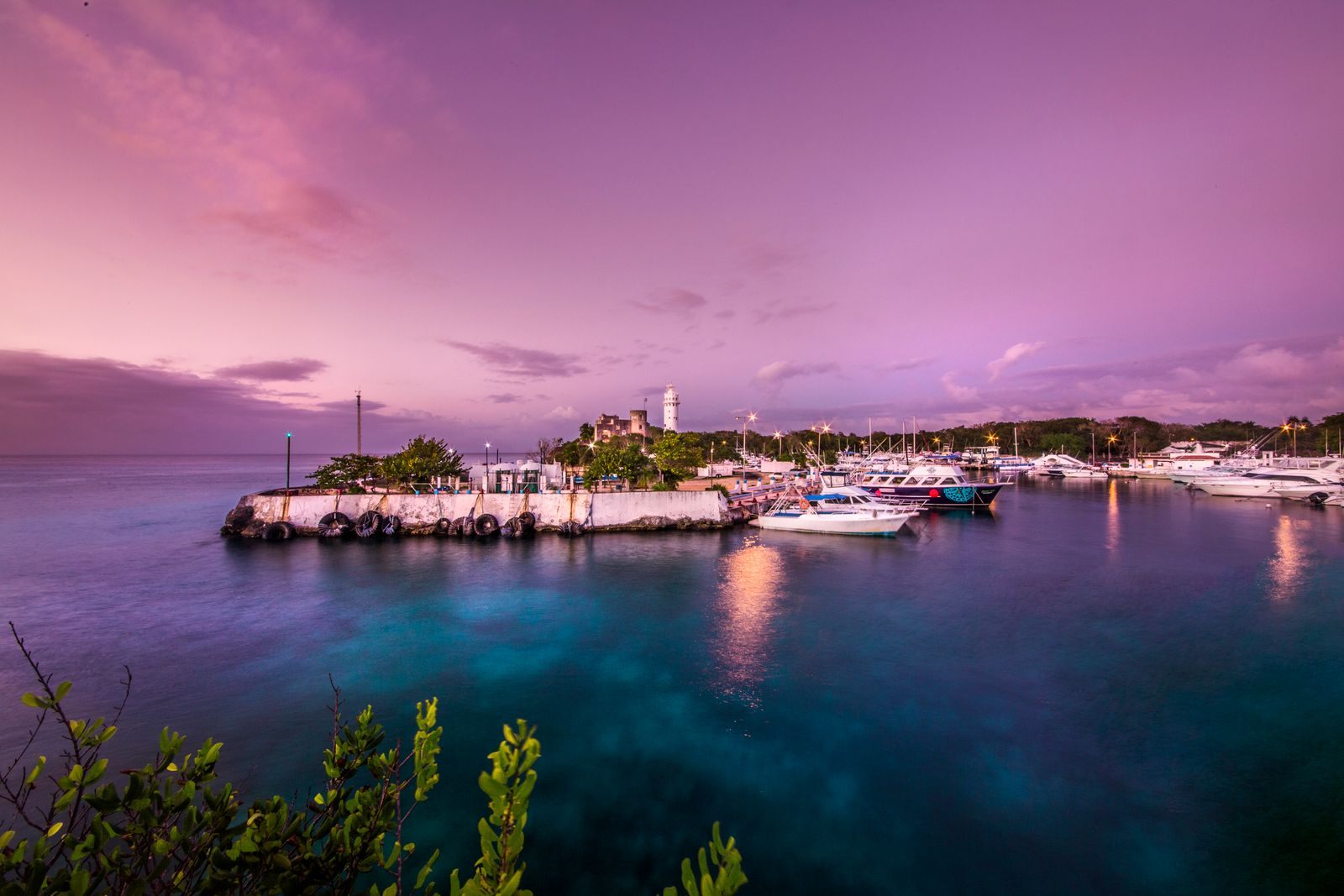 Harbor of San Miguel de Cozumel, Mexico, at dusk with boats moored