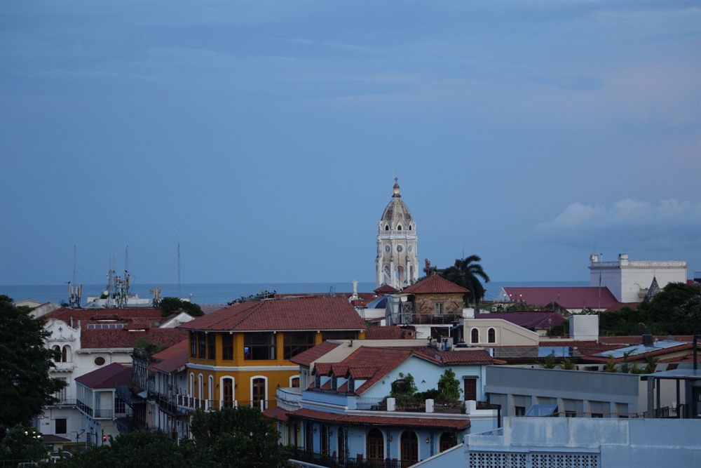Rooftops and a church tower in Cartagena, Colombia, with the sea beyond